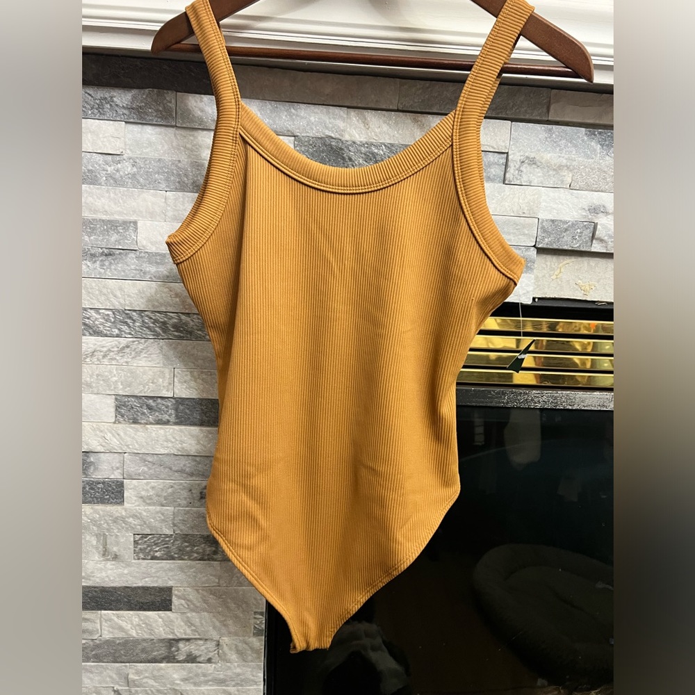 Light brown body suit.